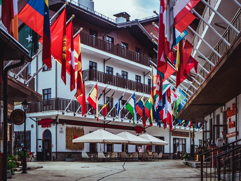 Photo of flags in a city, taken by Mike on pexels