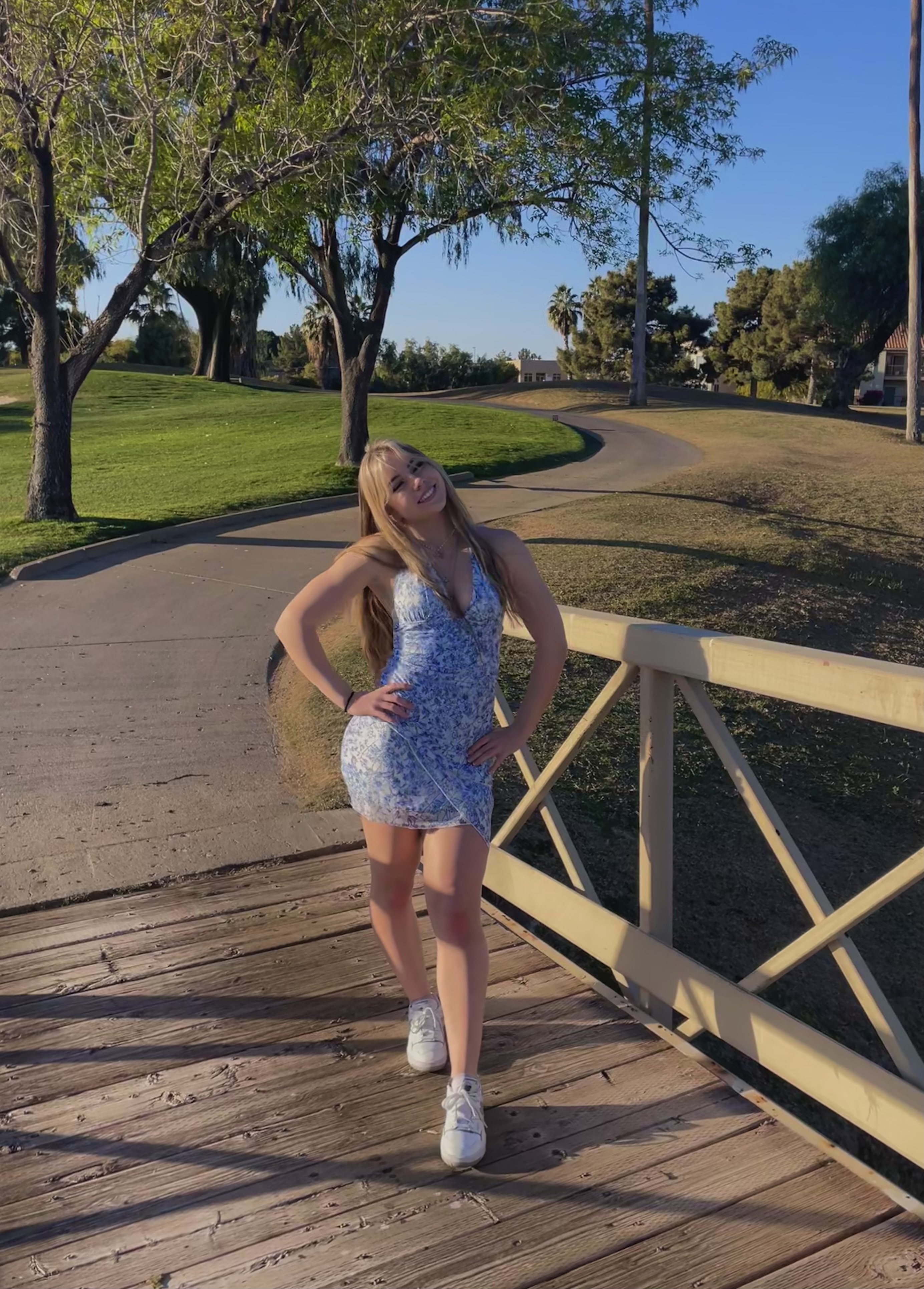 Isabelle standing on a bridge